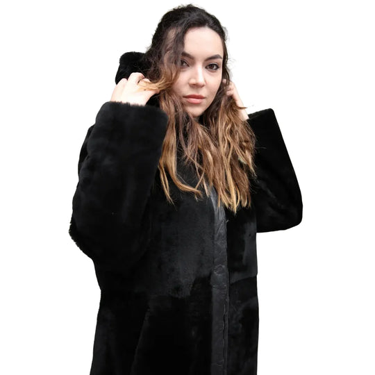 Close-up of the Avalon Black oversized reversible sheepskin long coat, featuring high-quality stitching, and a plush collar.