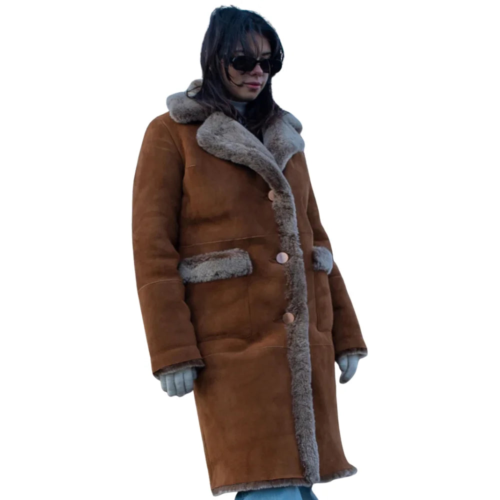 Close-up detail of the Sabina coat’s tobacco-colored full-grain leather and thick, cream-colored shearling lining.