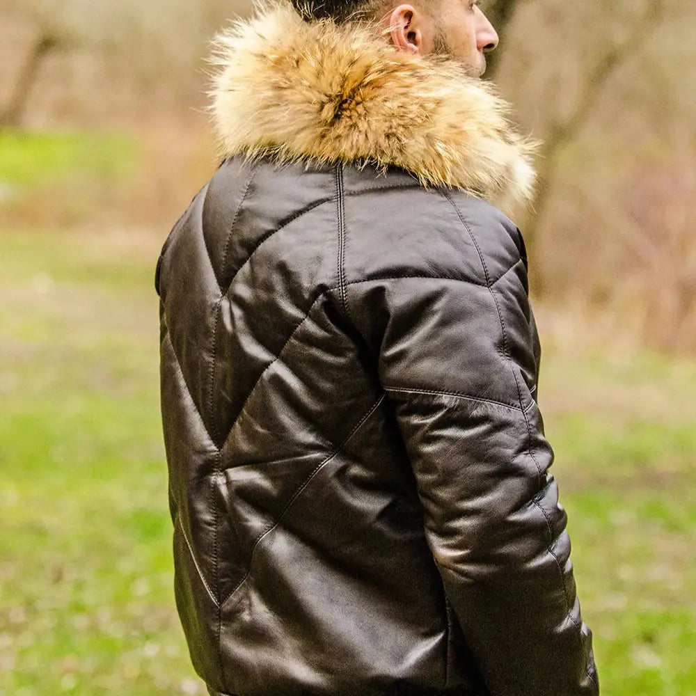 A model wearing the V-Bomber brown leather puffer, demonstrating the jacket’s high-volume fit and premium winter aesthetic.