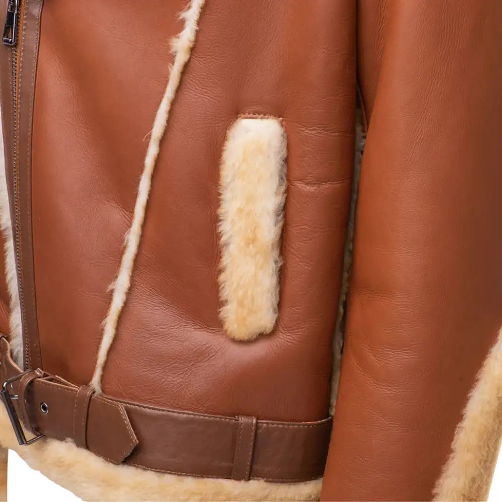 Alek's Biker Shearling Jacket detailed side view showing the rugged distressed leather design with fur trim along the edges.