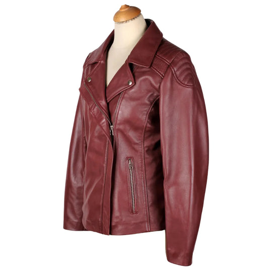 Close-up of the reinforced shoulder stitching and zippered cuffs on Ayla’s Women’s Burgundy Biker Leather Jacket, white background.