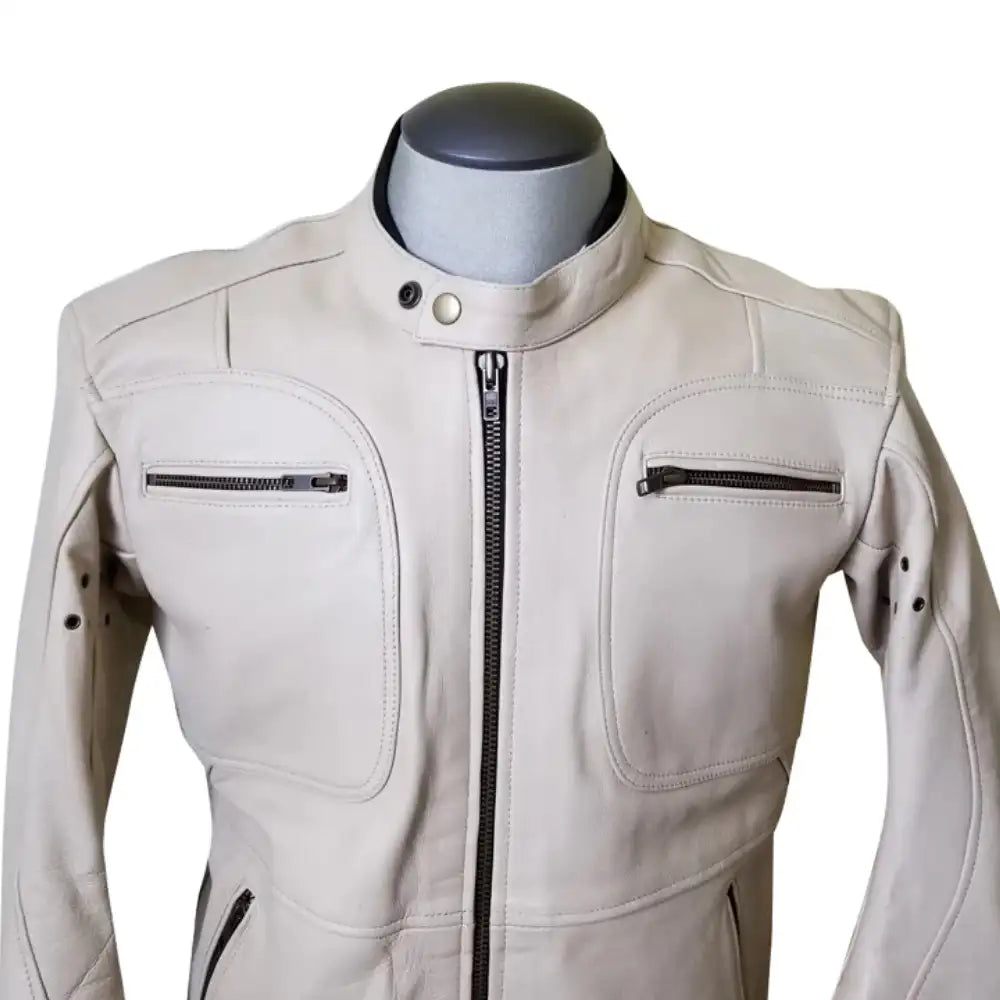 Detailed shot of the brushed nickel or antique silver zippers, which provide a soft contrast against the warm beige leather tones.