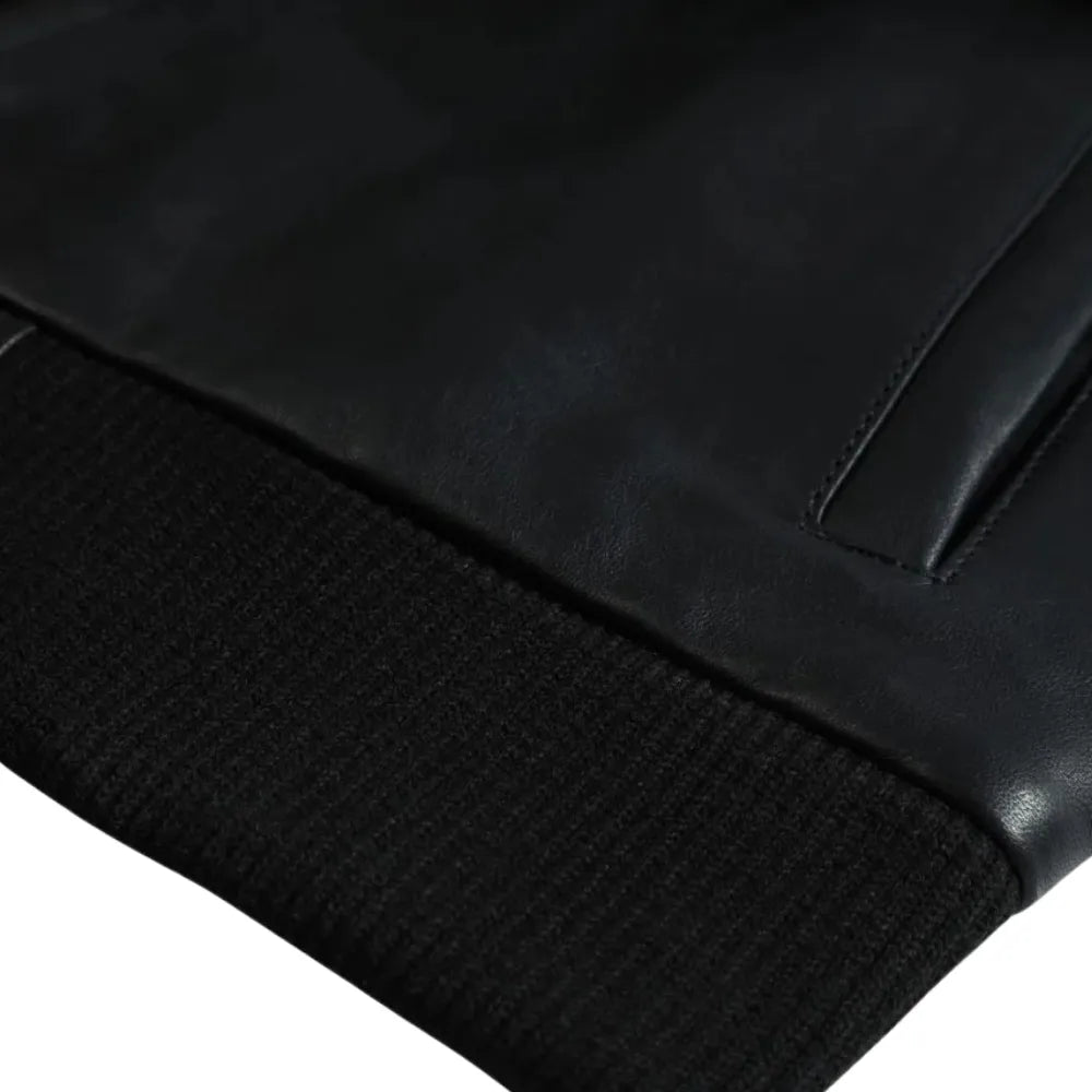 Black Bomber Style Ribbed Jacket front leather texture detail with ribbed waistband