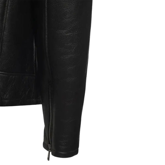 Close-up of the matte black A2 bomber jacket's wrist belt cuff with zipper detailing.