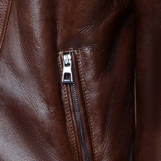 Detailed view of zippers and stitching on Carters Mateo leather biker jacket
