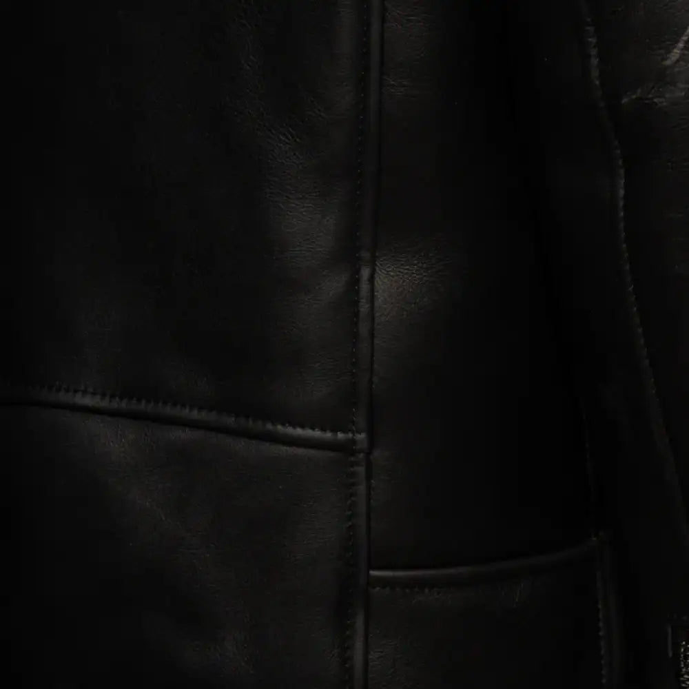 Closeup of zipper and buckle detail on Cater's Toscana Shearling Leather Biker Jacket