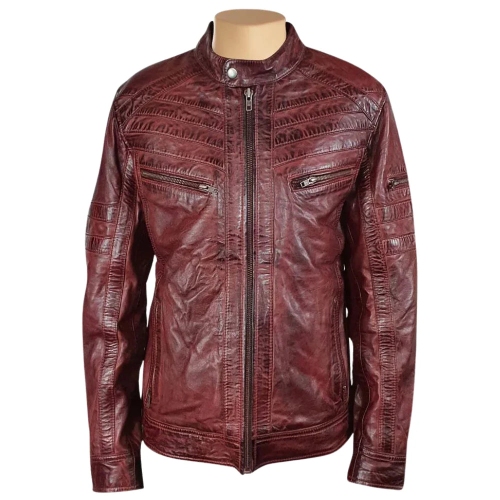 Front view of Charley Ellwood’s moto style burnished burgundy leather jacket with a quilted shoulder design on a white background.
