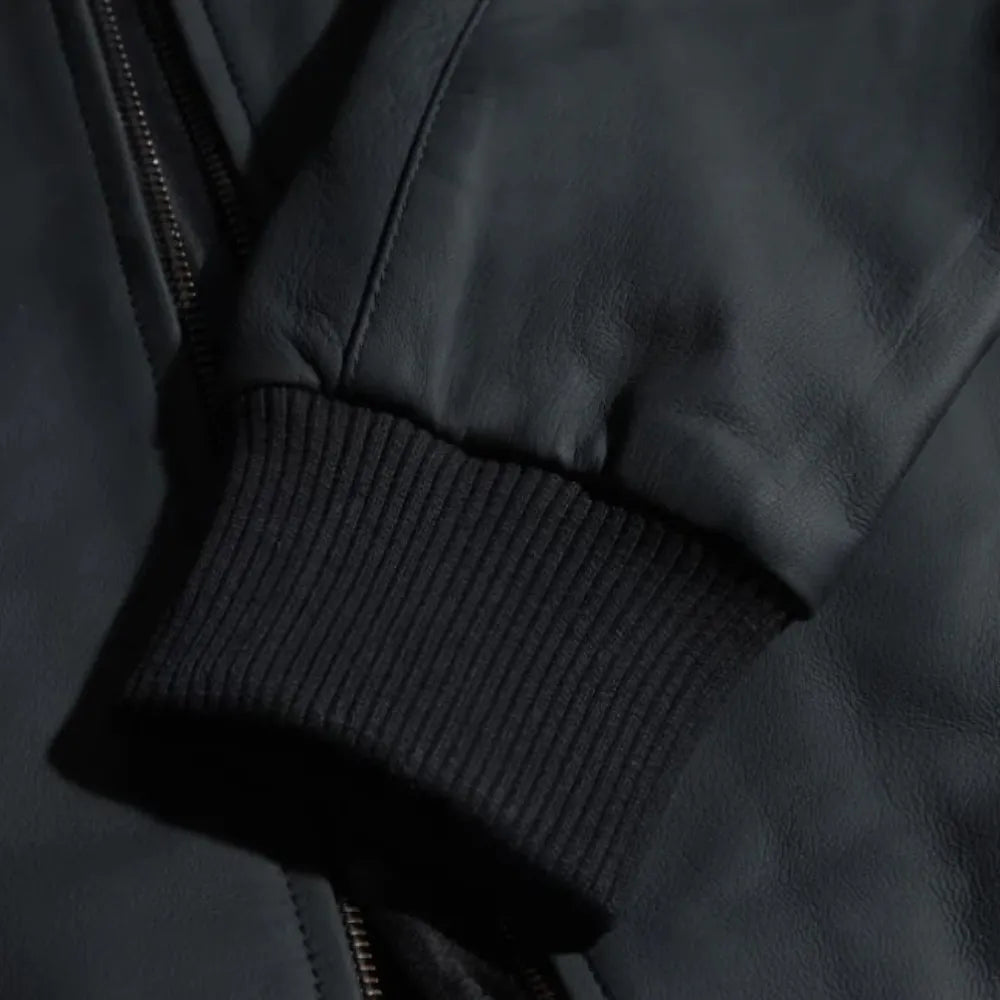 Colt Matte Black Ribbed Bomber Jacket close up of ribbed cuff on leather sleeve