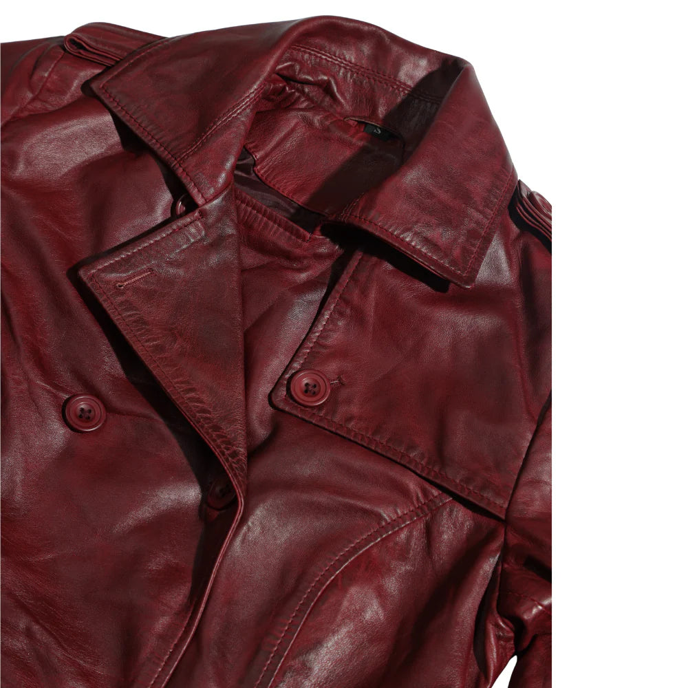 Close-up of a red leather jacket with buttons on a white background