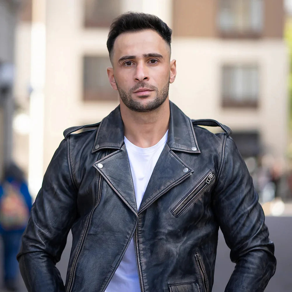Model wearing the distressed belted leather biker jacket, styled with casual clothing for a bold, biker-inspired appearance.