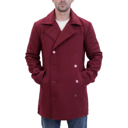 burgundy wool overcoat worn by a person hands in pocket on a white background