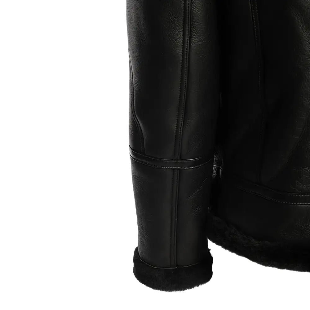 Detailed view of the sleek black bomber shearling jacket’s ribbed knit cuffs, adding a stylish and snug finish to the jacket's design.