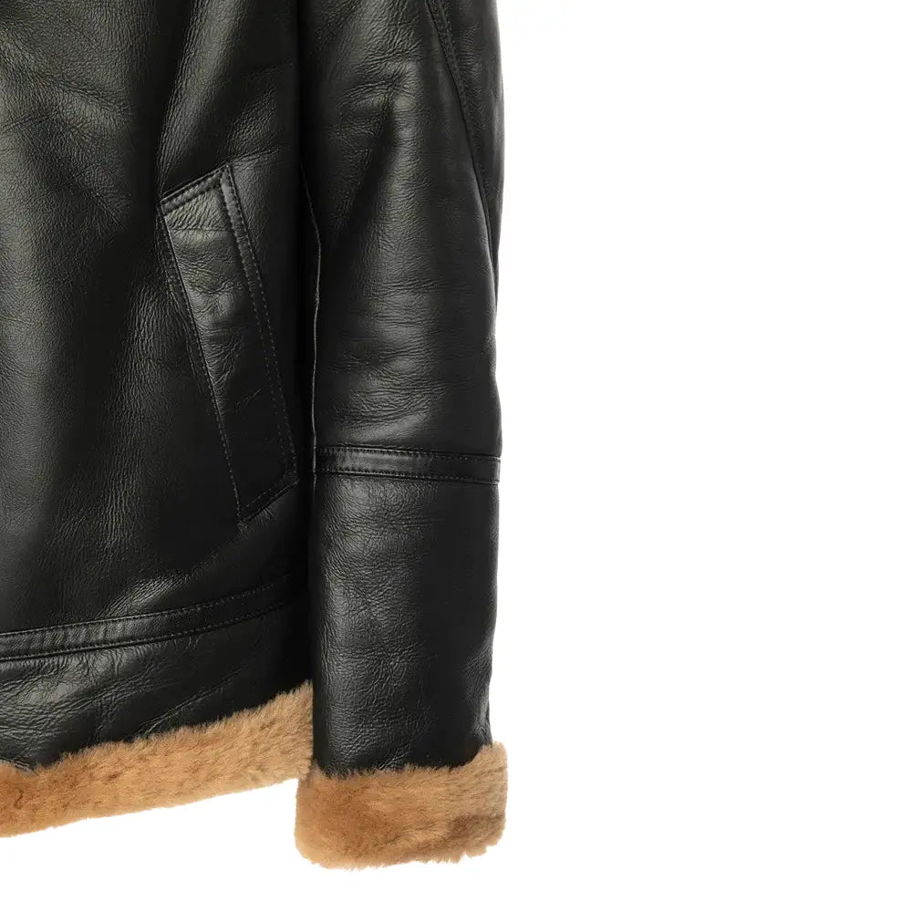 Detailed view of Slanted hand pockets on the black Aviator bomber shearling jacket