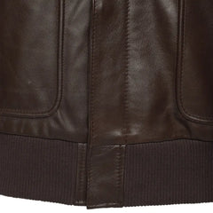 Close-up of a brown leather jacket with visible stitching and texture.