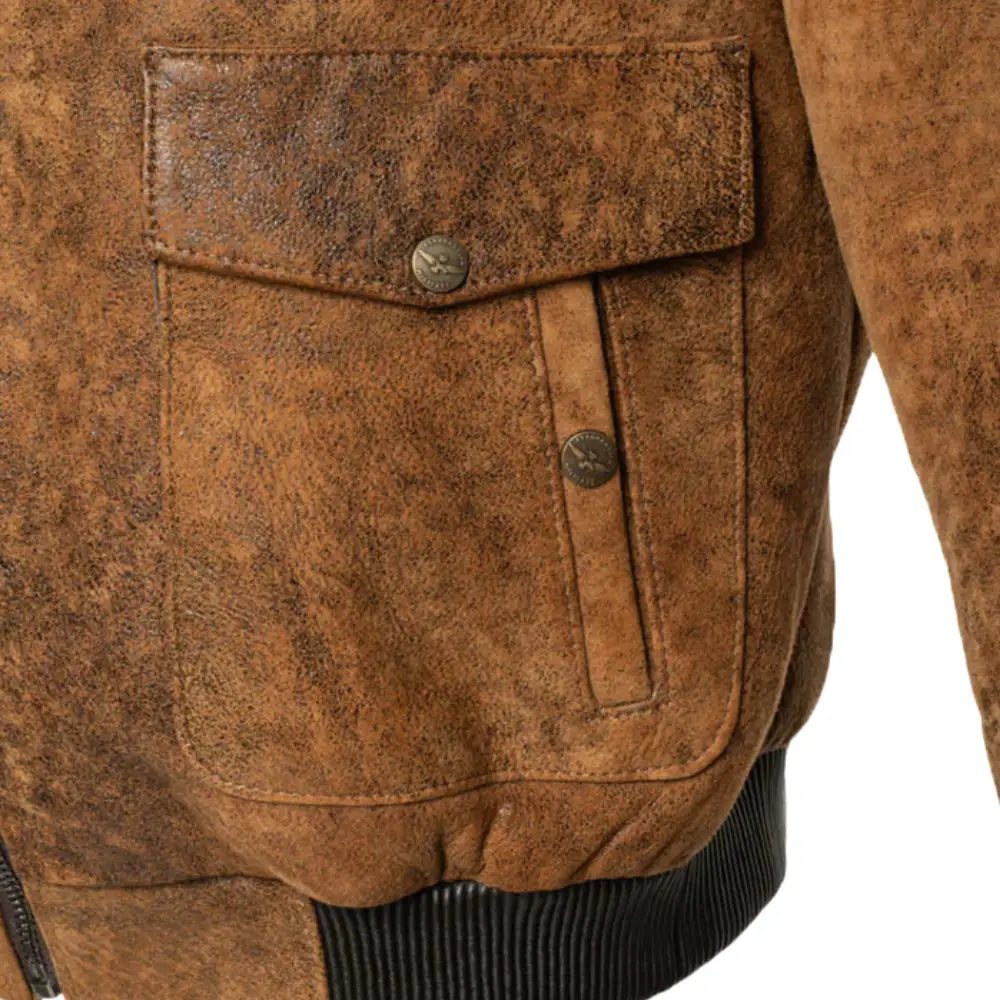 Front close-up showing dual flap pockets on Lucian's distressed brown A2 bomber shearling jacket.