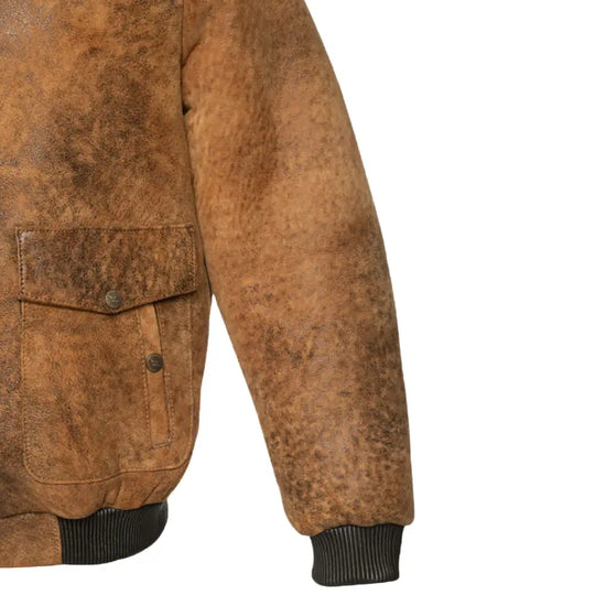 Close-up of the ribbed knitted cuffs on Lucian's distressed brown A2 bomber shearling jacket.