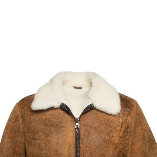 Lucian's distressed brown leather A2 flight jacket with the front closed, featuring the signature shearling collar.
