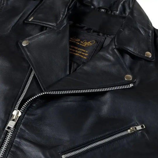 Close-up shot of the fine-grain leather and precision stitching that defines the Slim Fit Belted Leather Biker Jacket and its high-quality hardware.